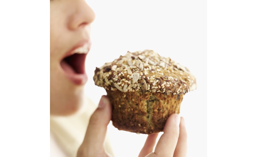 Person eating muffin