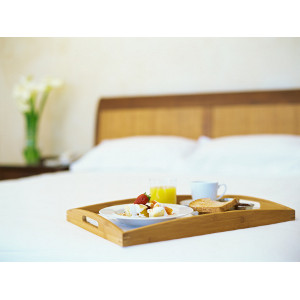 Food tray on hotel bed