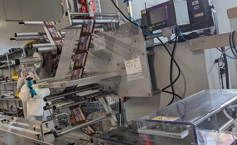 A flow wrapper sits idle, waiting for its turn in the action at the end of the Mars Global Research and Development Hub’s bar line