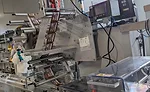 A flow wrapper sits idle, waiting for its turn in the action at the end of the Mars Global Research and Development Hub’s bar line
