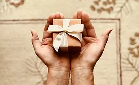 holding chocolate box in hand generic