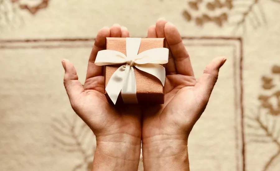 holding chocolate box in hand generic