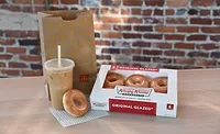 Krispy Kreme gives free doughnuts to McDonald's patrons Krispy Kreme gives free doughnuts to McDonald's patrons