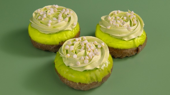 A group of cupcakes with frosting and white dots

AI-generated content may be incorrect.