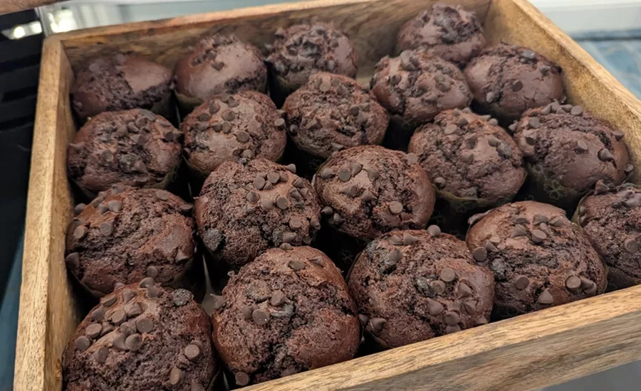 Wooden tray of chocolate chip muffins, courtesy of Jenni Spinner