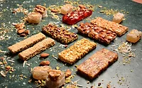 pexels-tarek-shahin-153182669-12428388.jpg Assortment of different snack bars on table