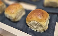 IFT2025_ArdentMills.jpg Display of buttery buns on black napkins