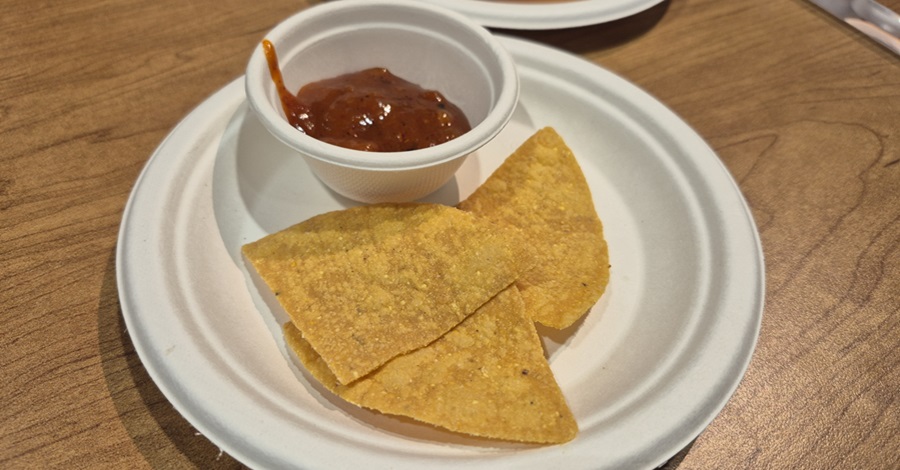 Paper plate with tortilla chips and salsa