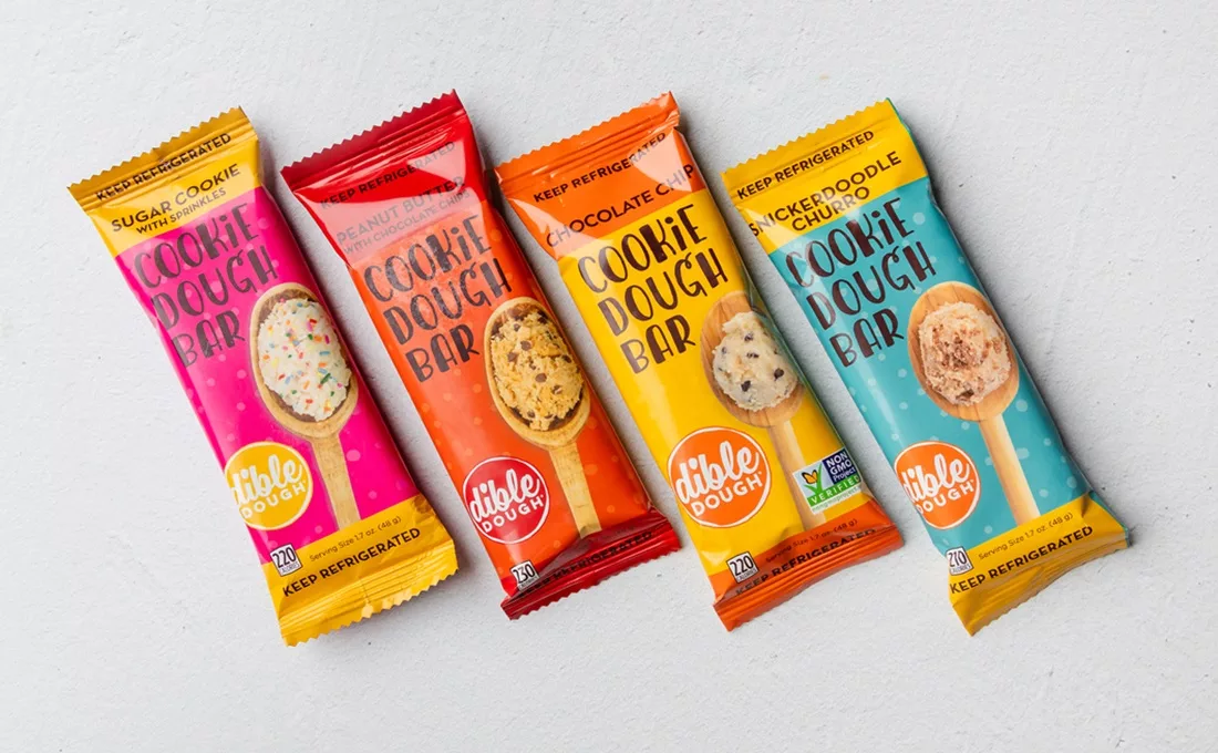 Four bars of Dible Dough edible cookie dough