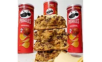 Pringles_lead.jpg Stack of cookies in front of three cans of Pringles