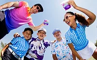 Children and adults wearing colorful clothes, shot from below