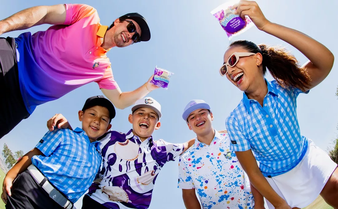 Children and adults wearing colorful clothes, shot from below