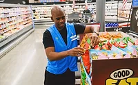 NBA player Christ Paul with Good Eat'n snack display at Walmart