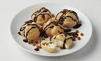 Plate of baked goods adorned with boba balls