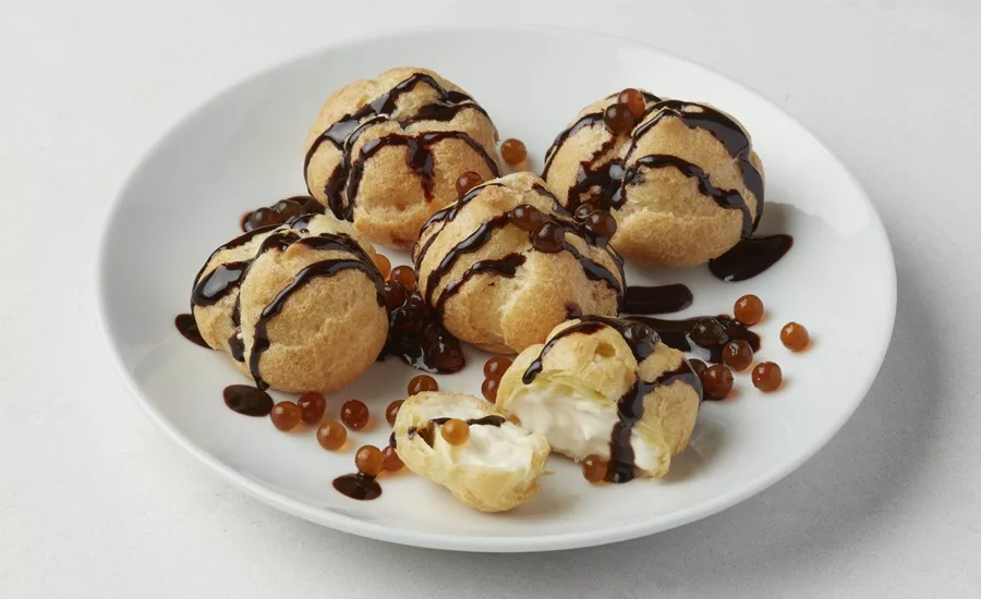 Plate of baked goods adorned with boba balls