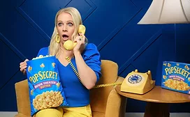 Melissa Joan Hart chats on phone with Pop Secret popcorn
