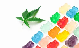 hemp leaf next to gummy bears