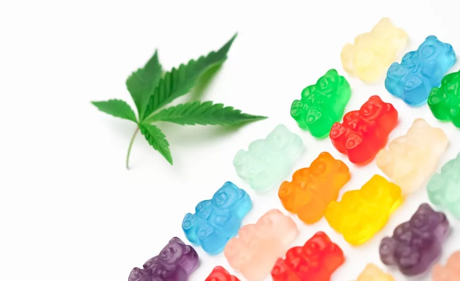 hemp leaf next to gummy bears