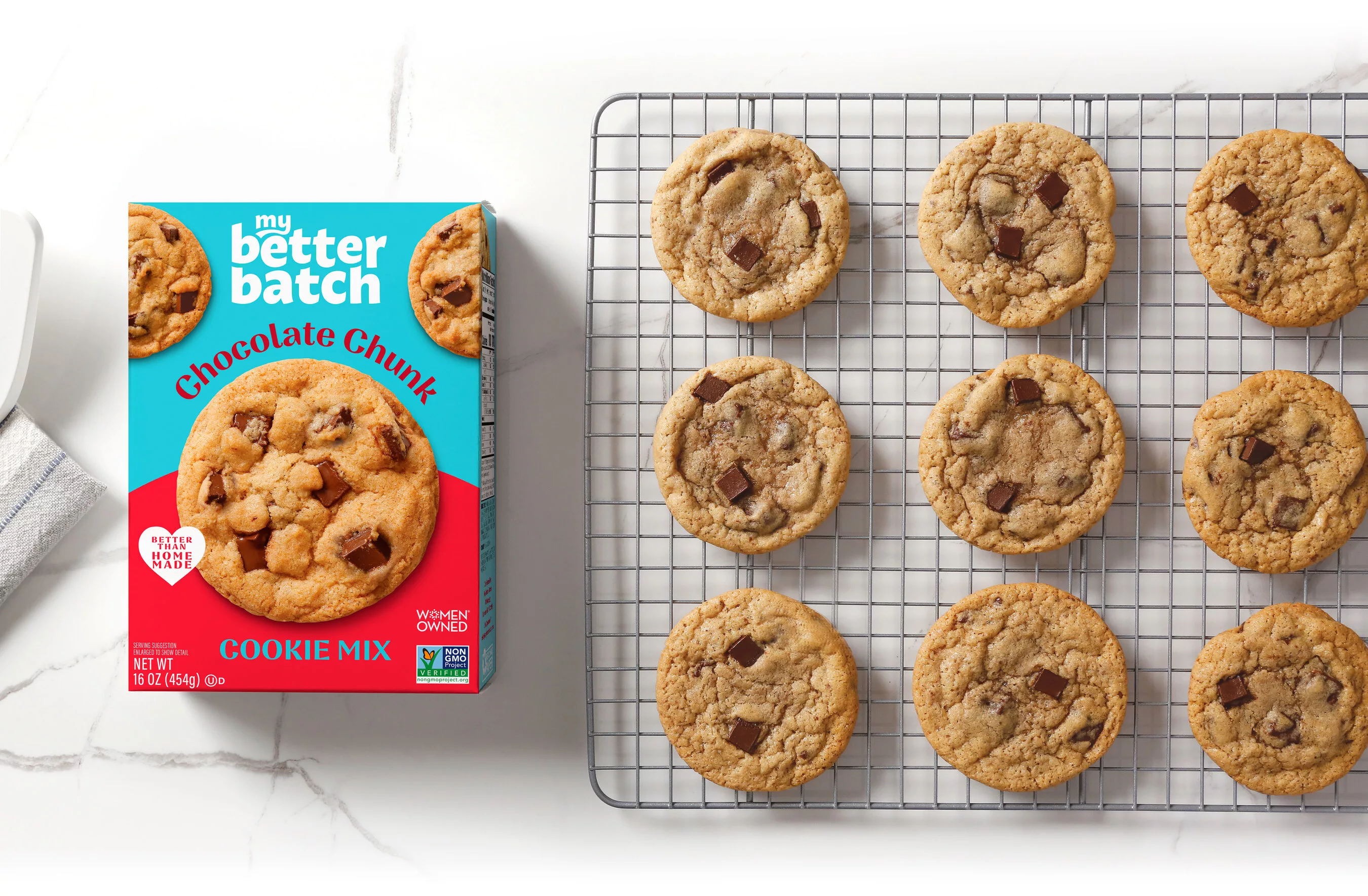 Box of cookie mix next to chocolate chips cooling