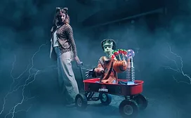 Child robot in Frankenstein costume with adult woman