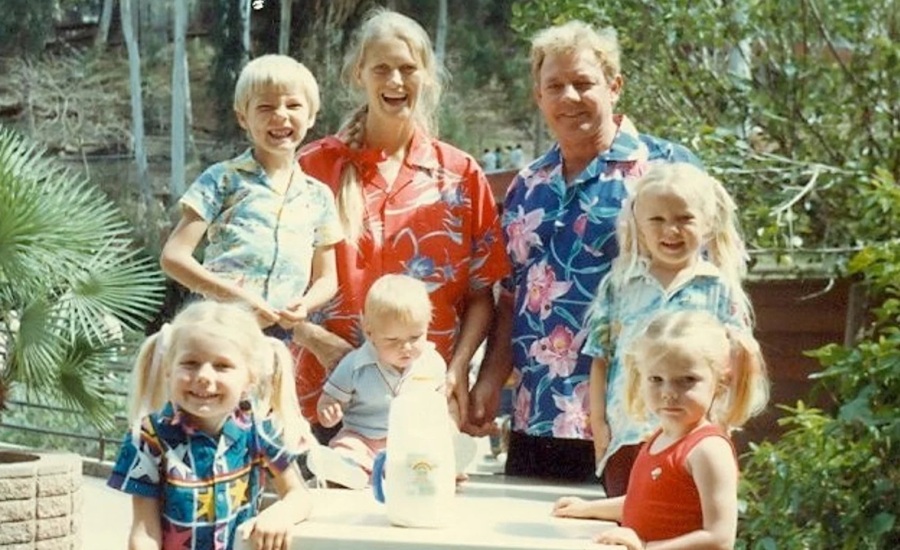 Family outside in colorful shirts