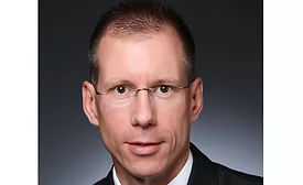 White man, clean shaven with short hair
