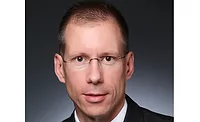 White man, clean shaven with short hair