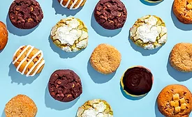 Assorted premium cookies on light blue background