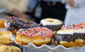 Assorted, multicolored doughnuts on a table