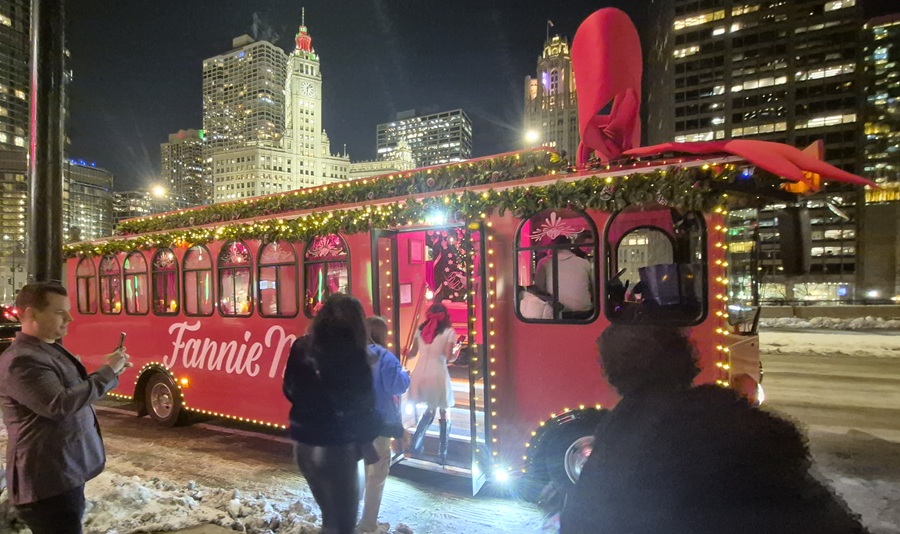Red Fannie May trolley in front of Chicago skyline