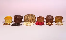 Line of assorted cakes on a pink background