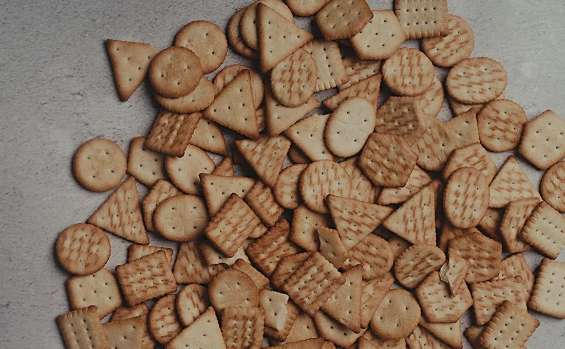 Pile of different cracker shapes on a table