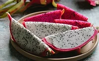 pexels-any-lane-5945775.jpg Slices of dragonfruit on a white plate