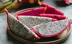 Slices of dragonfruit on a white plate