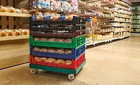 Multicolored bakery trays in a grocery store