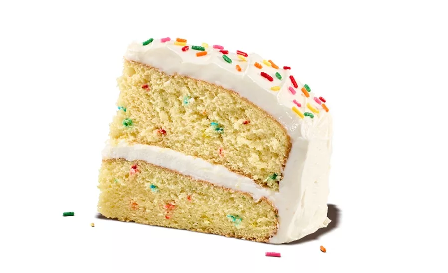 Slice of vanilla layer cake with Funfetti sprinkles