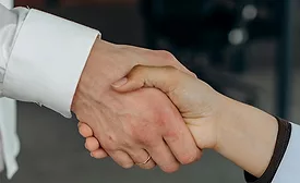 Two caucasian hands shaking