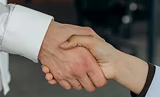Two caucasian hands shaking