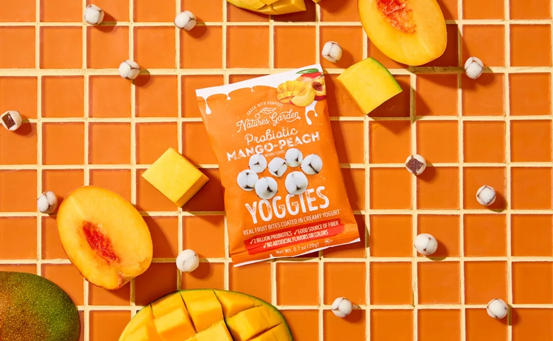 Pouch of Nature's Garden fruit snacks on decorated orange table