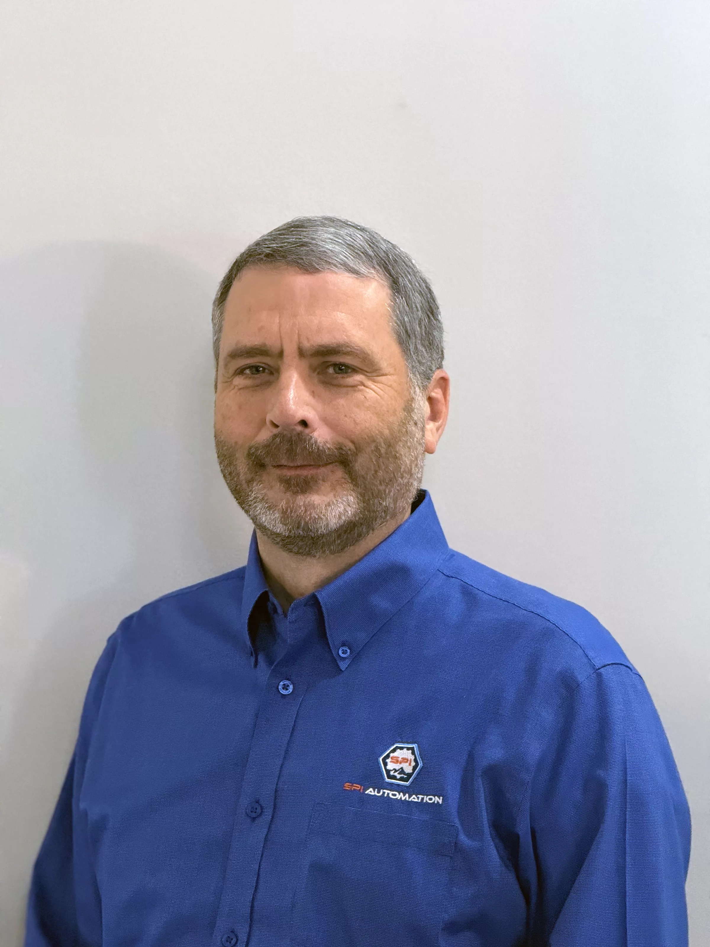 Ryan Park, a white man with short hair and a beard in a blue shirt