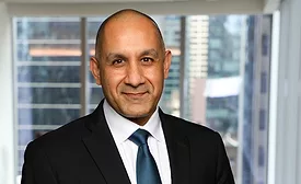 Dark-skinned smiling man in suit