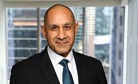 RR_aaron.jpg Dark-skinned smiling man in suit
