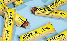 Barebells - BB.jpg Bunch of Barebells Banana Bread bars on blue background