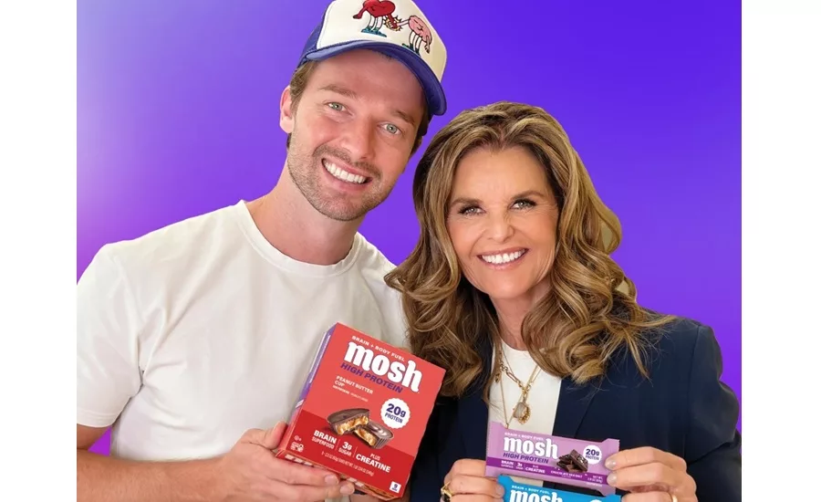 Patrick Schwarzenegger and Maria Shriver holding Mosh bars