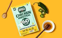 Pouch of Mighty Spark chicken sticks on yellow background