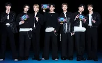 OREO BTS.jpg Group of attractive Korean men from BTS on black background eating Oreo cookies