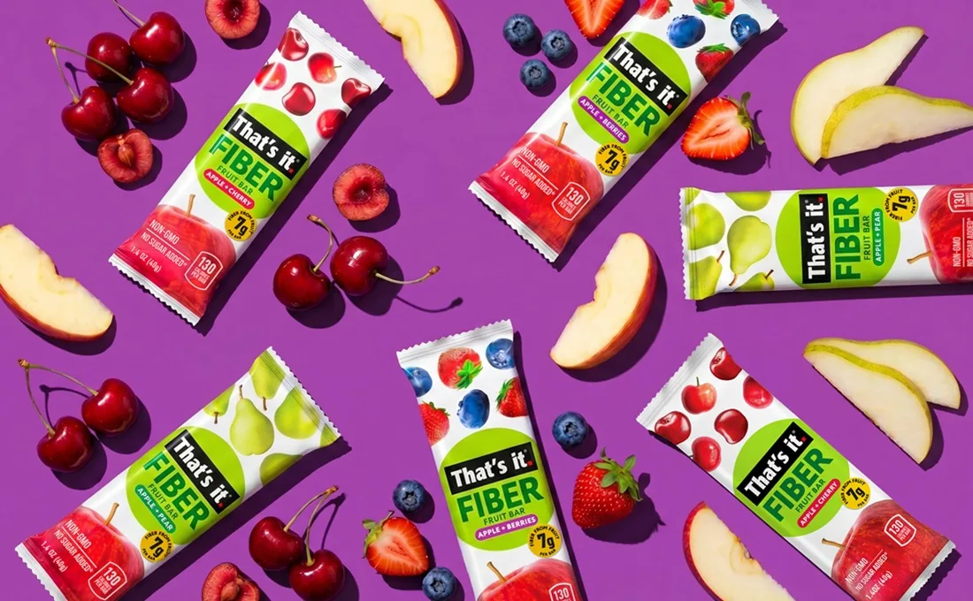 Assorted packs of That's it fiber fruit bars on purple background