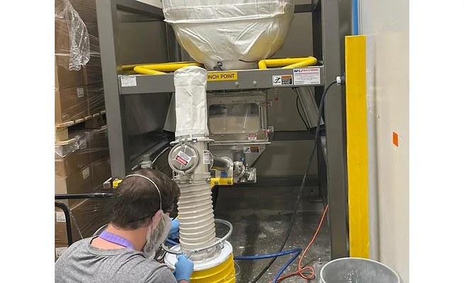 Powder transfer integrates conveyor, bulk bag unloader