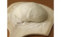Dough on floured board Dough on floured board
