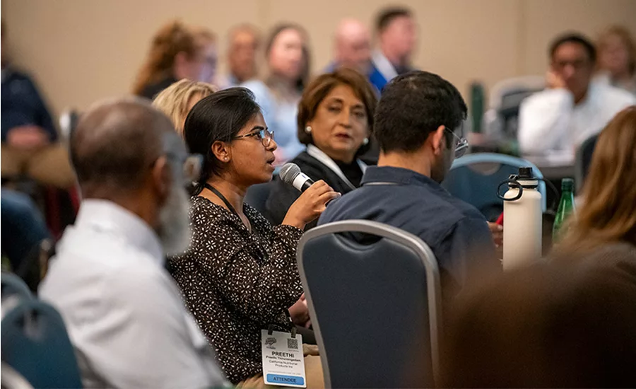 woman asking question at the summit
